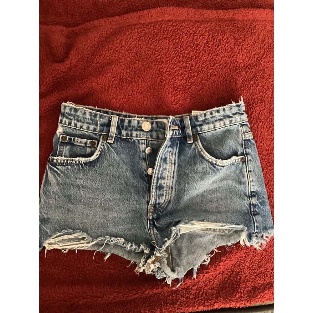 Zara denim cutoff shorts featuring a button fly‎ and distressed hem Size 2